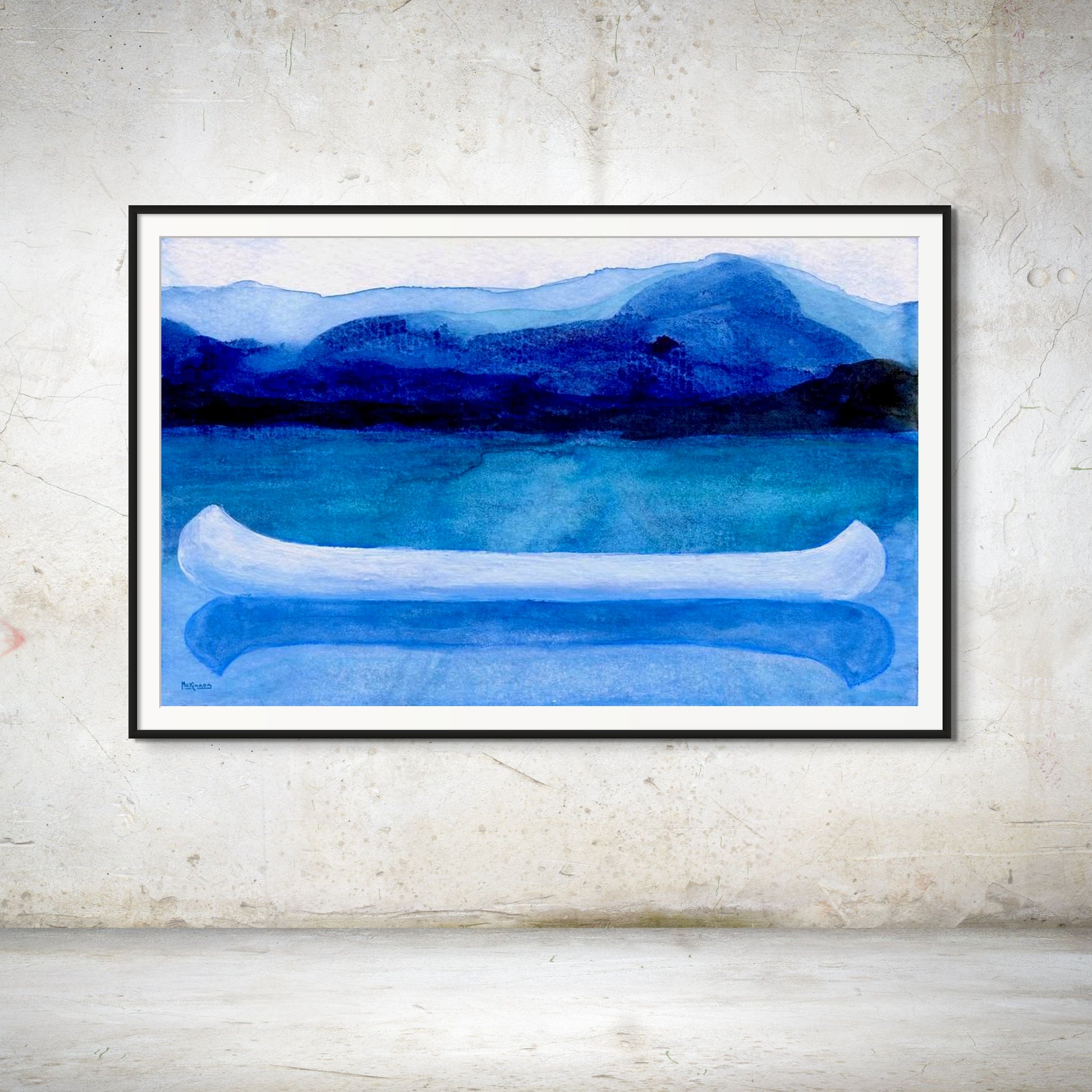 A work of canoeing art by Canadian artist Catherine McKinnon. The watercolor depicts a small white boat, a "canoe", on blue water with a dark blue distant shore and lighter blue distant moutains. The giclee print is framed in black with white matting and is mounted on a light gray textured wall.